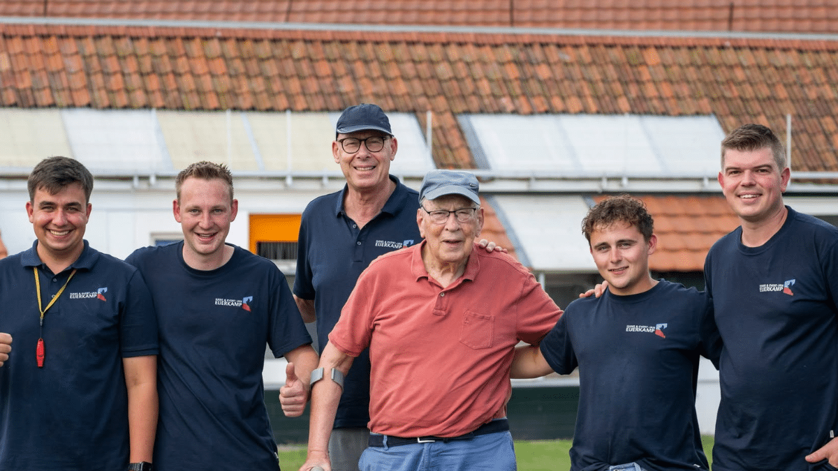 The Eijerkamp Racing Pigeons team together outside the loft, representing the family tradition and international ambition behind their Pont Saint Maxence victory.